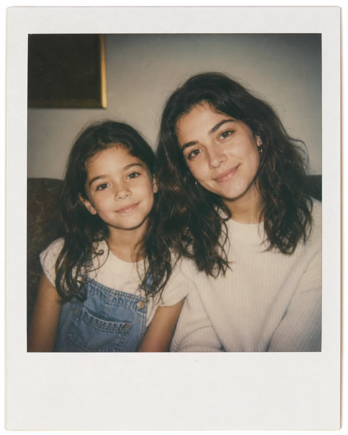 Polaroid-style photo of younger self and present-day self sitting side by side