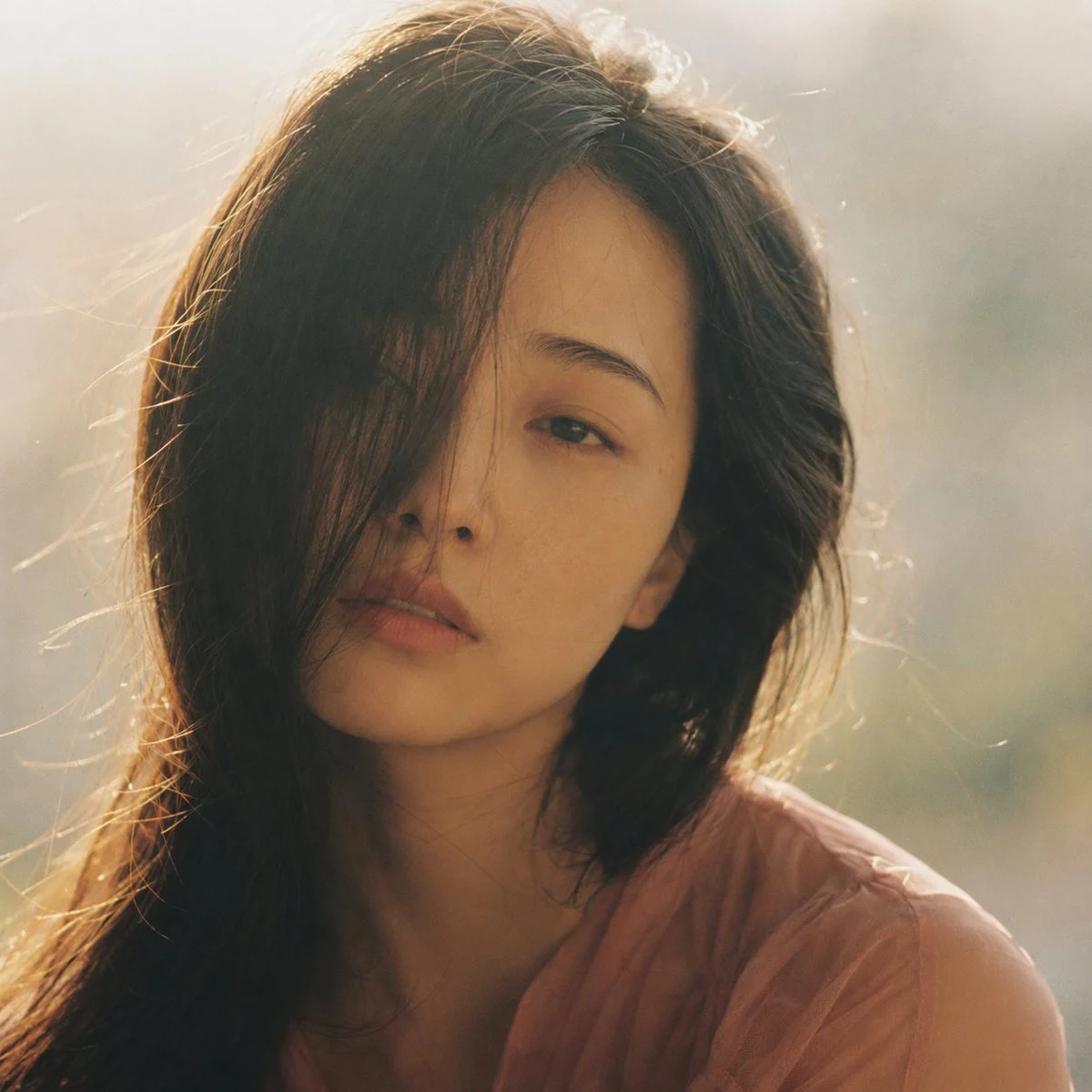 Dreamy Hazy Film Portrait with expressive portrait lighting, detailed styling and a polished editorial mood
