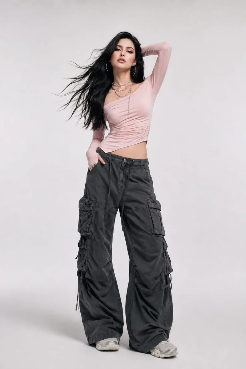 High-fashion studio portrait of a woman in contemporary streetwear with clean lighting and editorial styling