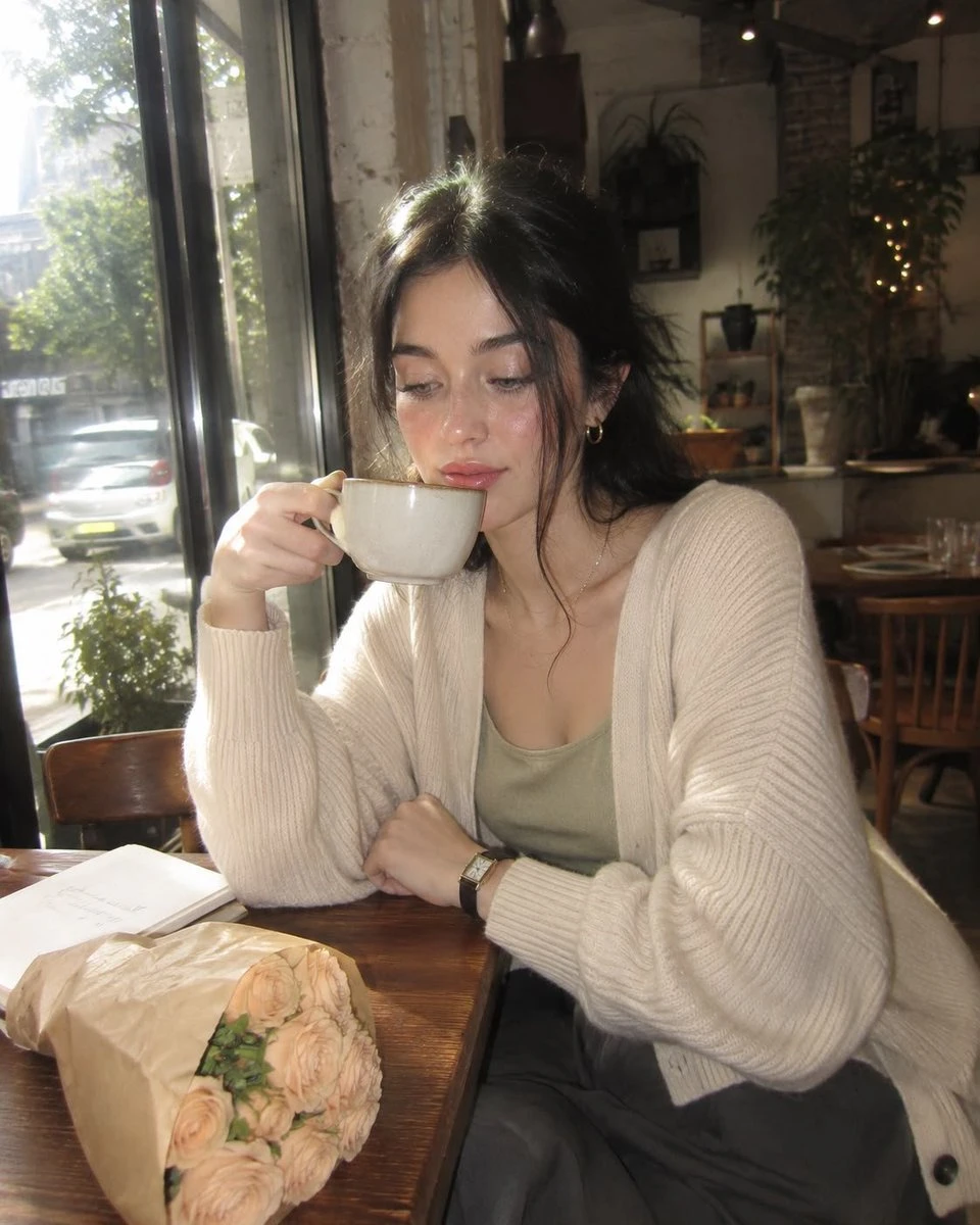 Early-2000s cafe snapshot portrait with compact-camera flash, dreamy daylight, and nostalgic lifestyle framing.