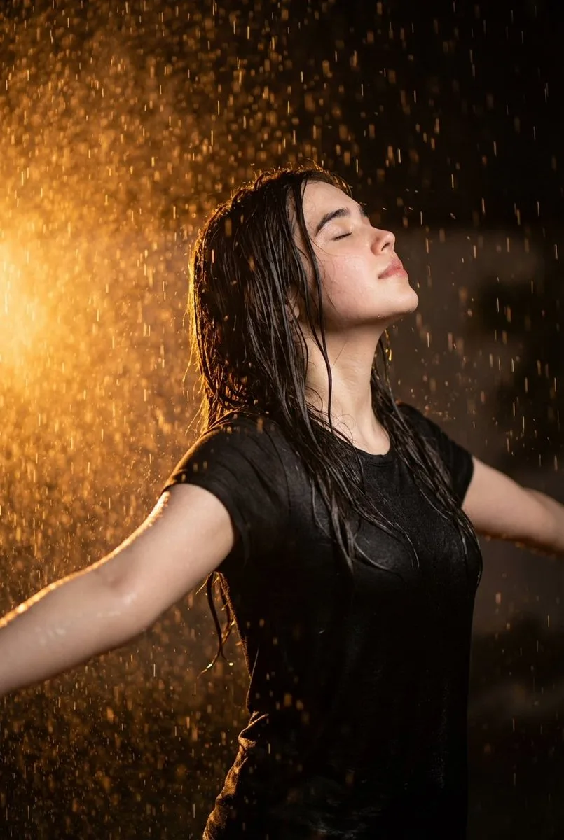 Rainy Night Cinematic Portrait showing an editorial portrait subject with styled wardrobe, lighting and background detail