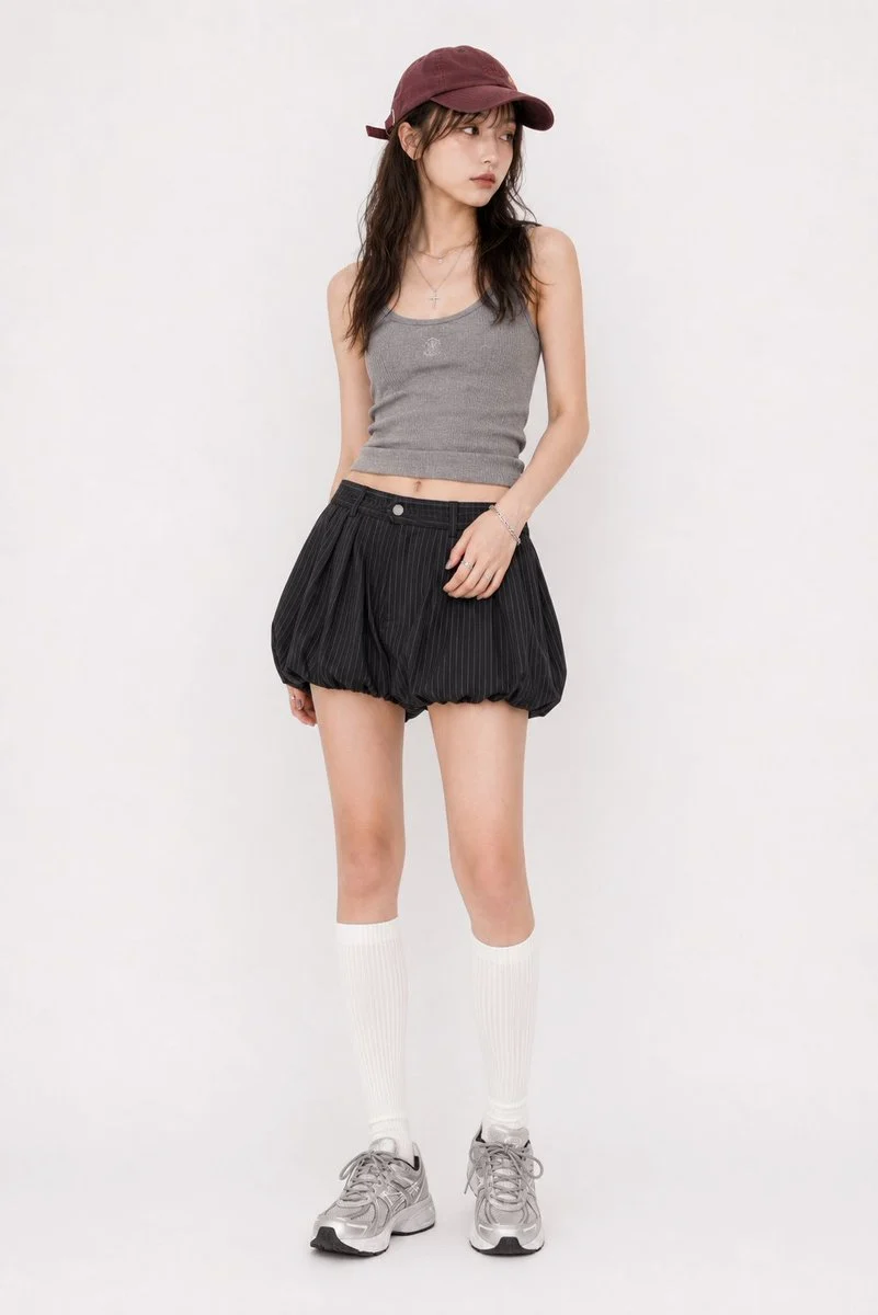 Y2K Street Ribbed Tank Top Outfit: A minimalist Y2K streetwear prompt featuring a ribbed knit tank top and balloon skorts with a pinstripe pattern.