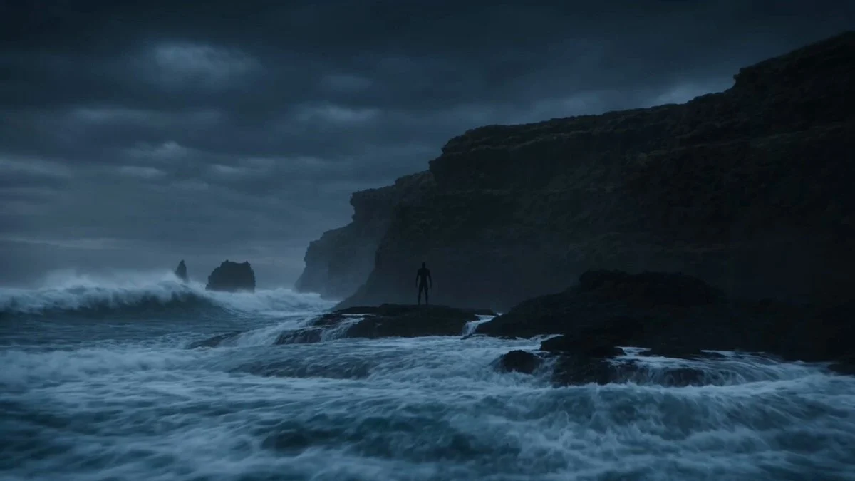 Figure transforms into a giant living tsunami on a stormy coast