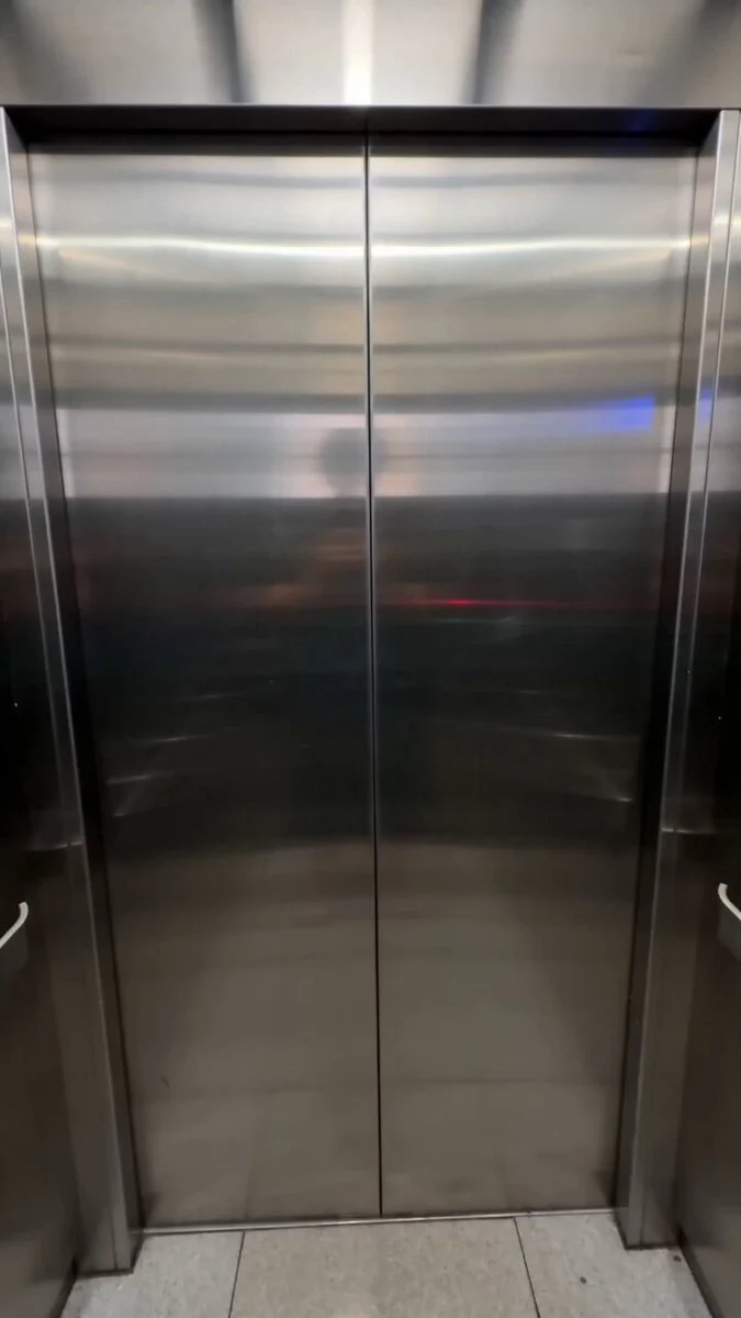 POV elevator scene with a surprising celebrity-style encounter